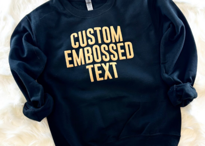 Black sweatshirt with gold text