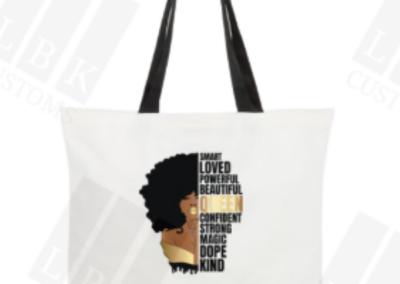 Tote with picture of a queen with empowering text black handle and black base.