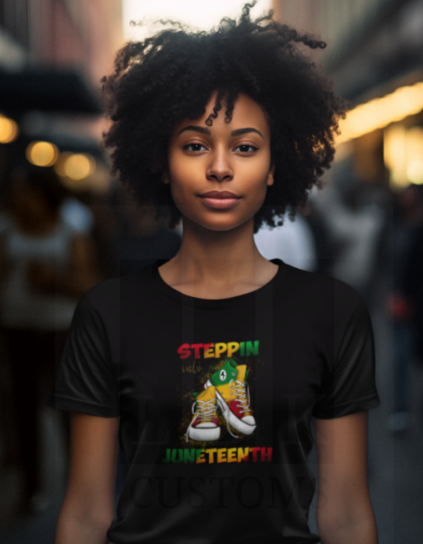 African American woman with black curly hair with a black tee- Steppin in