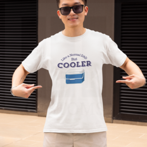 Man in white shirt with glasses pointing at his shirt